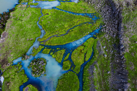 Aerial braided glacial streams over moss and lava in Icelandの写真素材