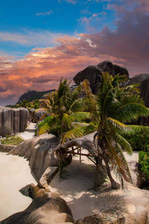 La Digues Anse Source dArgent boulders at sunset with palmsの写真素材