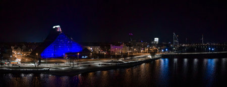 Riga night view with National Library and Vansu Bridge reflectionsの写真素材