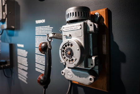 Soviet era rotary telephone on wood mount in museum displayの写真素材
