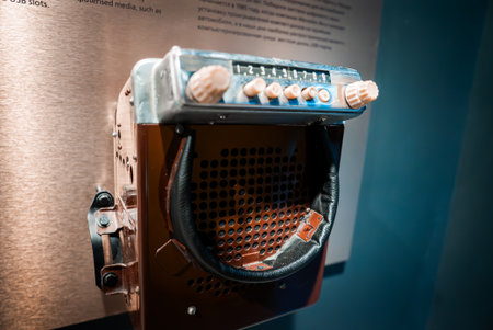 Vintage car radio and speaker display in museum exhibit lightingの写真素材