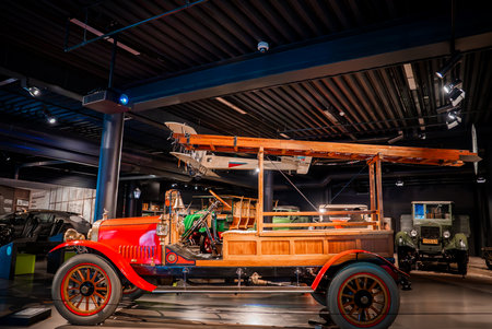 Restored early 20th century fire truck in auto museum exhibit