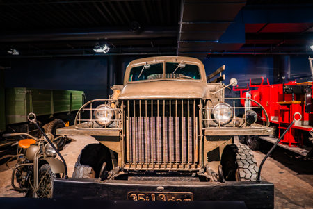 Vintage military truck display with motorcycle and fire engine