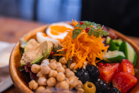 Close up Tokyo salad bowl with chickpeas, olives, avocado, eggの写真素材