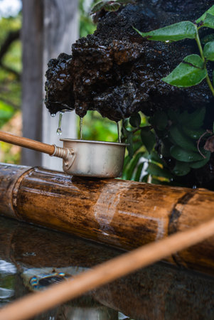 Tokyo shrine temizuya with bamboo basin and ladle in close up viewの写真素材