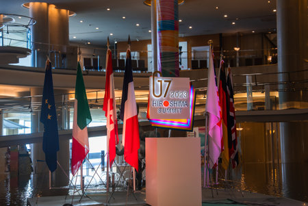 G7 2023 Hiroshima Summit display in atrium with flags and podiumの写真素材