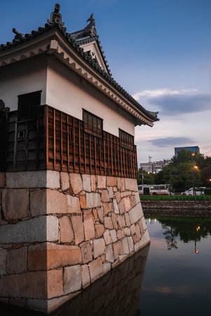 Osaka Castle turret and moat reflection at dusk in Osaka, Japanの写真素材