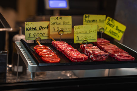 Premium wagyu skewers on a grill tray at a Kyoto market stallの写真素材