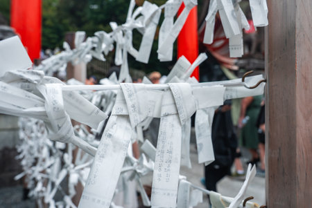 White omikuji fortune slips tied at Fushimi Inari Taisha, Kyotoの写真素材