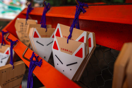 Fox face ema plaques on orange rack at Fushimi Inari Taishaの写真素材
