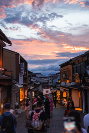 Kyoto street descends past machiya shops near Kiyomizu dera at sunsetの写真素材