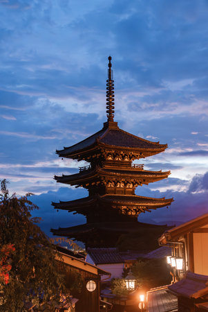 Yasaka Pagoda at twilight in Kyoto framed by wooden machiyaの写真素材