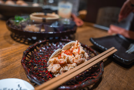 Kyoto eatery close up of bao with crab salad and chopsticksの写真素材