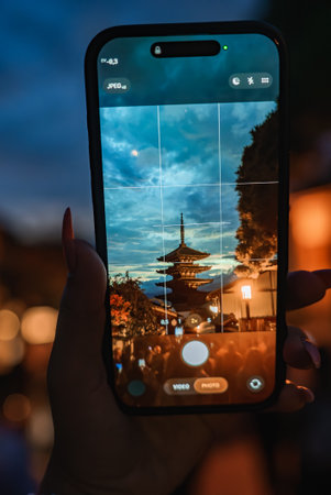 Smartphone frames Yasaka Pagoda at twilight in Kyoto, Japanの写真素材
