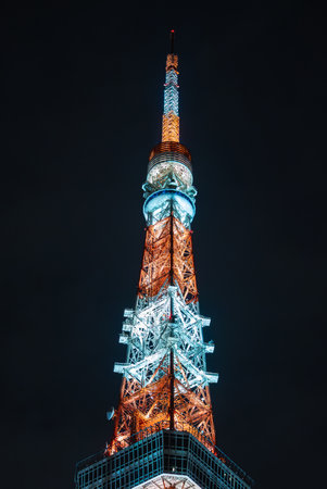 Illuminated upper Tokyo Tower lattice in Minato at nightの写真素材