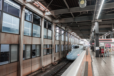 Shinkansen arrives at indoor platform in Hiroshima railway station