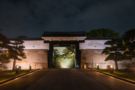 Otemon gate of Osaka Castle Park at night with warm ground lightsの写真素材