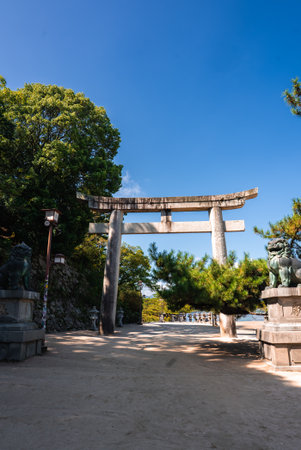 Stone torii and komainu on shrine approach in Itsukushima, Japanの写真素材