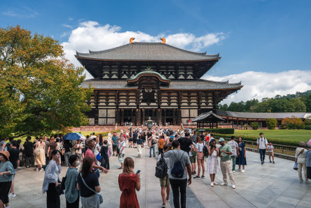 Tourists at Todai ji Great Buddha Hall in Nara during daytimeの写真素材