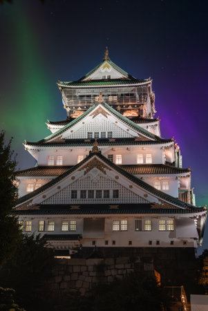 Osaka Castle illuminated at night with aurora like glow in Osaka, Japanの写真素材