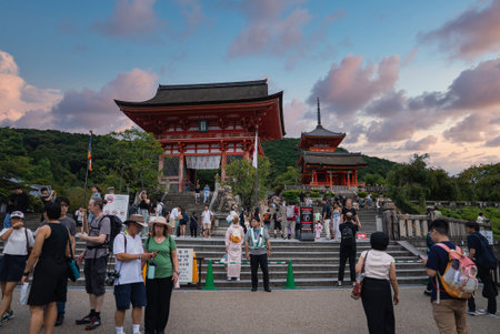 Crowds at Kiyomizu dera Nio mon gate in Kyoto at sunsetの写真素材