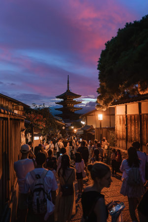 Evening crowds on Higashiyama lanes toward Yasaka Pagoda in Kyotoの写真素材