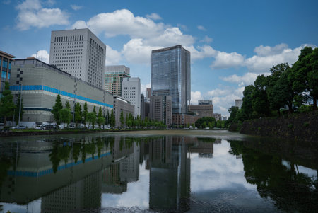 Canal reflections by office towers near Tokyo Imperial Palace moatの写真素材