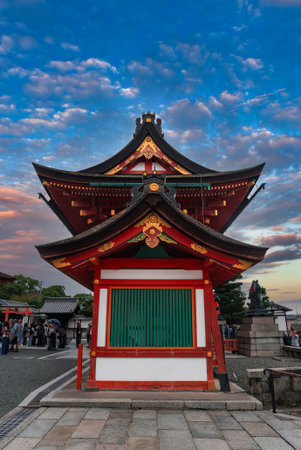 Crowds at Fushimi Inari Taisha shrine in Kyoto during blue sunsetの写真素材