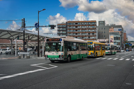 City buses line up by JR Nara Station near modern terminal in Naraの写真素材