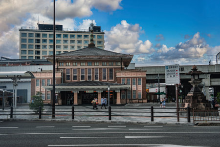 JR Nara Station facade with pagoda roof and forecourt activityの写真素材