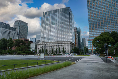 Weekday scene in Tokyo Marunouchi with glass towers and plazaの写真素材
