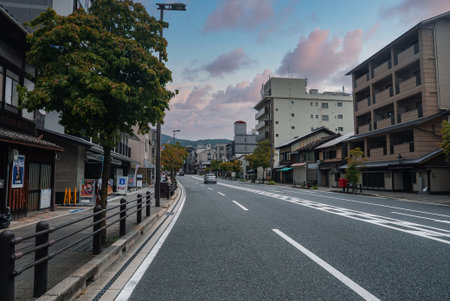 Kyoto street with machiya facades and modern blocks at eveningの写真素材