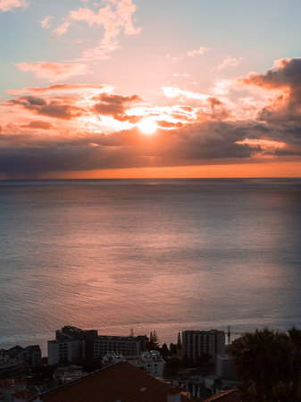 Sunset over Funchal hillside hotels and Atlantic horizon, Madeira