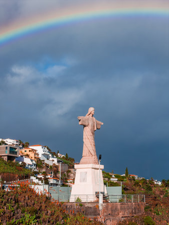 Cristo Rei do Garajau statue and rainbow near Canico, Madeiraの写真素材