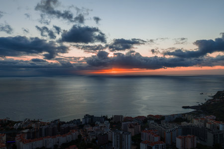 Dusk view of Funchal, Madeira with red roofs and Atlantic horizonの写真素材