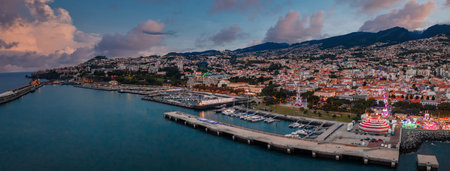 Aerial twilight over Funchal harbor, Marina do Funchal and pierの写真素材