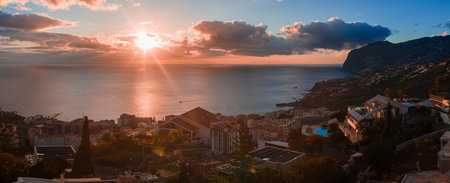 Sunset panorama of cascading hills and Atlantic bayの写真素材