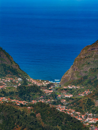 Aerial view of a Madeira valley opening to the Atlantic Oceanの写真素材