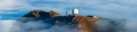 Aerial view of Pico do Arieiro radar dome above clouds, Madeira