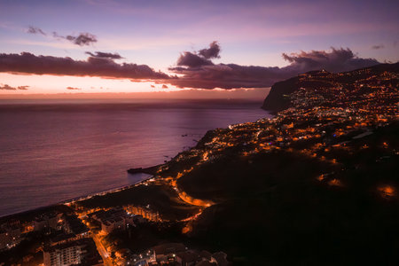Dusk aerial of Funchal hills and Atlantic coast in Madeira, Portugalの写真素材
