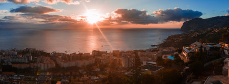 Funchal at sunset with Cabo Girao and harbor under warm low light
