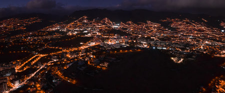 Nighttime aerial panorama of Funchals terraced coastal hills in Madeiraの写真素材