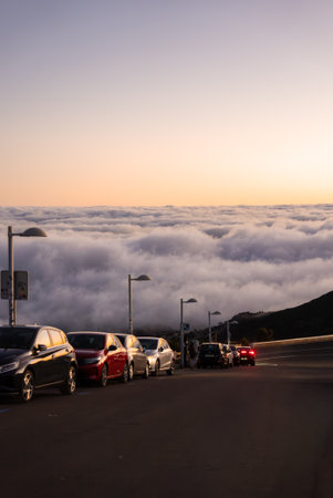 Mountain road at sunset above clouds near Pico do Arieiroの写真素材