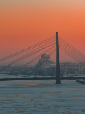 Vansu Bridge and National Library at dusk in Riga, Latvia