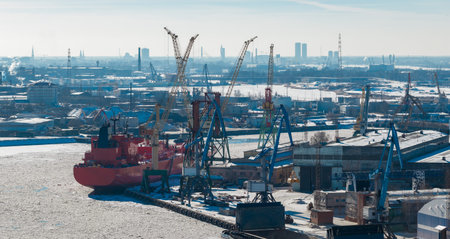 Aerial winter view of Riga Shipyard and frozen Daugava River