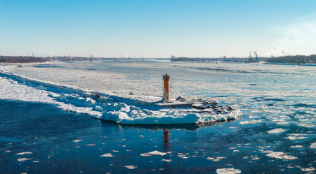 Aerial winter view of Mangalsala Lighthouse at Daugava River mouthの写真素材