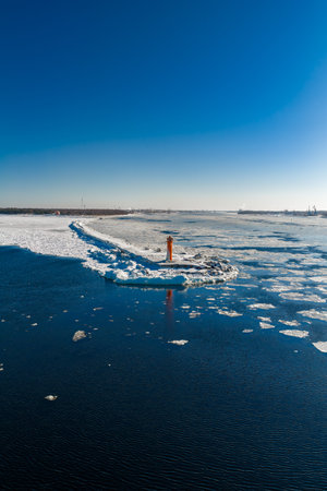 Aerial winter view of Mangalsala Lighthouse at Daugava River mouthの写真素材