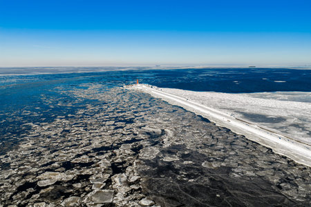 Aerial winter view of Mangalsala breakwater and lighthouse, Rigaの写真素材