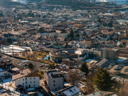 Aerial winter view of Brixen, Italy, with Acquarena spiral complexの写真素材