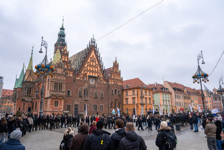 Crowd gathers at Wroclaw Market Square by Gothic Old Town Hallの写真素材